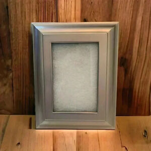 Picture frame, 4” by 6”, silver  plastic frame with felt back